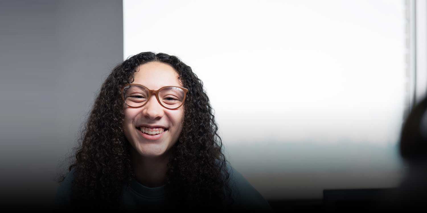 Smiling student in classroom