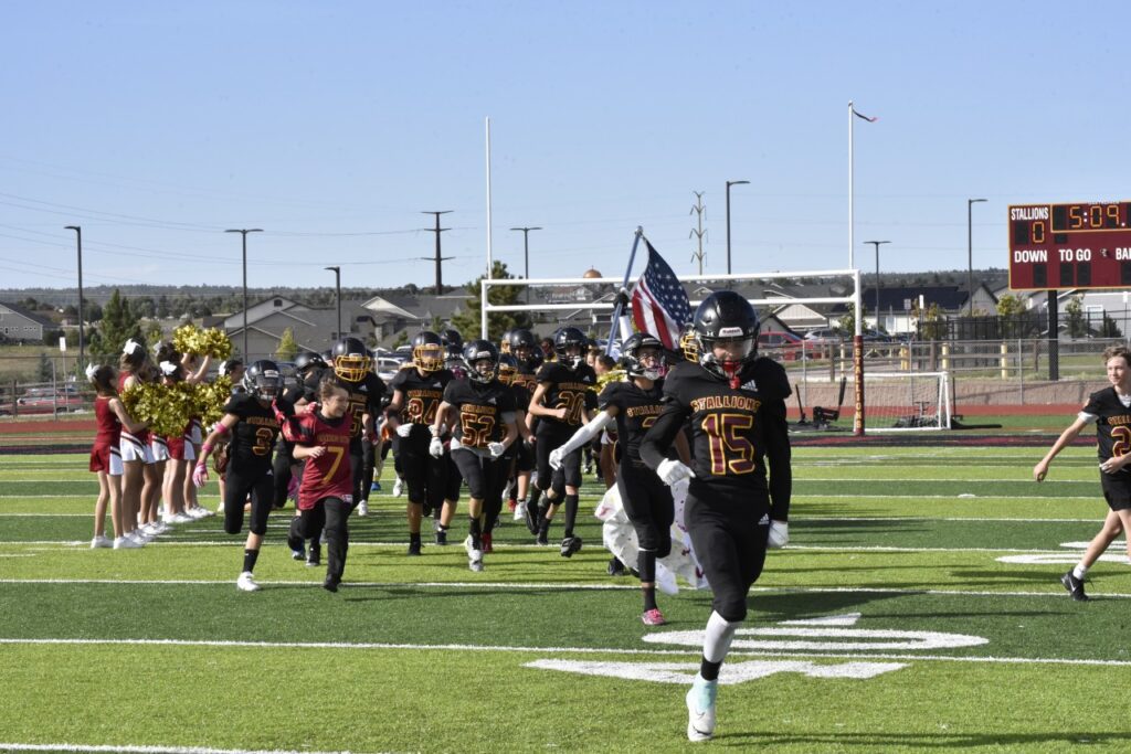 Football Team running onto field
