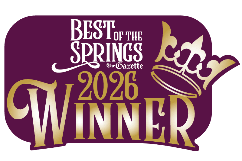 Purple, gold and white logo with gold crown 